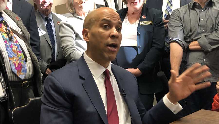 Sen. Cory Booker speaks to reporters after filing for the NH primary ballot Nov. 15, 2019.