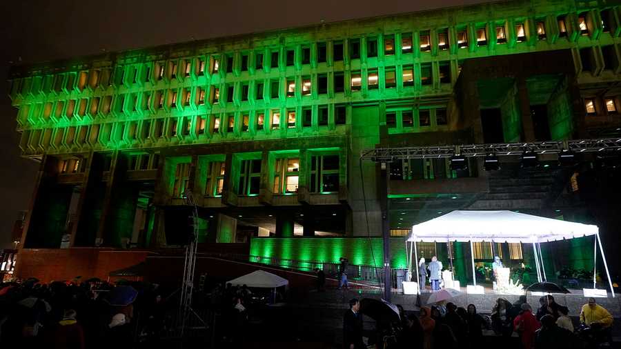 Boston City Hall is illuminated with green light following a ceremony attended by Britain's Prince William and Kate, Princess of Wales, Wednesday, Nov. 30, 2022, in Boston. The ceremony was held to highlight the Earthshot Prize.