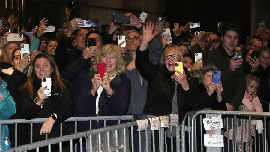 Crowds of people wave as Britain's Prince William and Kate, Princess of Wales, walk to Boston City Hall Plaza, Wednesday, Nov. 30, 2022, in Boston. (AP Photo/Charles Krupa, Pool)