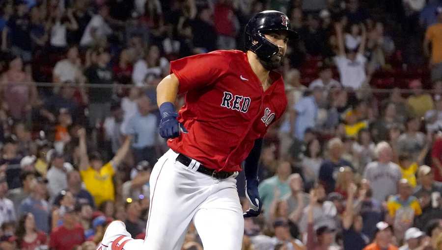 Boston Red Sox&apos;s Eric Hosmer runs toward first after hitting an RBI double during the sixth inning of the team&apos;s baseball game against the Baltimore Orioles at Fenway Park, Thursday, Aug. 11, 2022, in Boston. (AP Photo/Mary Schwalm)