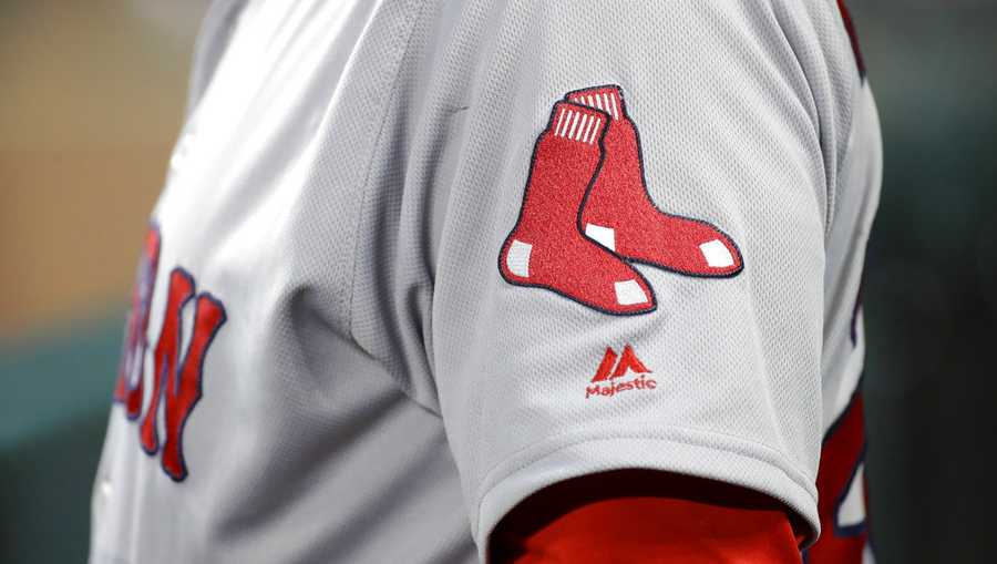 The Boston Red Sox logo is seen on first base coach Ruben Amaro Jr&apos;s jersey during a baseball game against the Baltimore Orioles in Baltimore, Saturday, April 22, 2017. (AP Photo/Patrick Semansky)