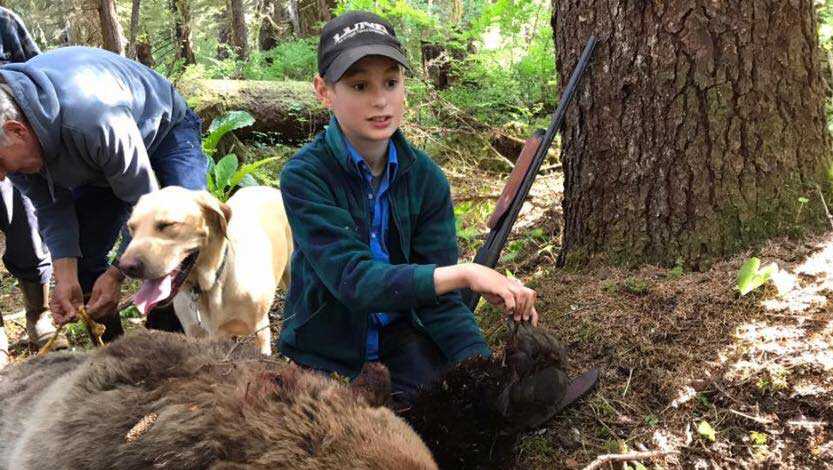 Eliot, 11, with the bear he shot in Alaska