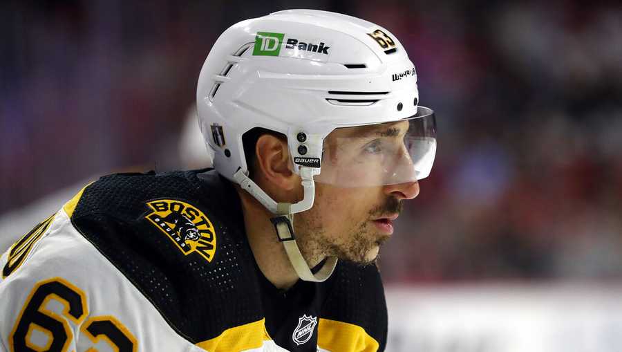Boston Bruins&apos; Brad Marchand (63) waits for a face-off against the Carolina Hurricanes during the first period of Game 7 of an NHL hockey Stanley Cup first-round playoff series in Raleigh, N.C., Saturday, May 14, 2022. (AP Photo/Karl B DeBlaker)