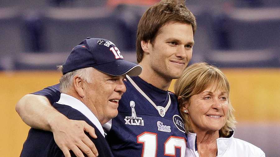 New England Patriots quarterback Tom Brady (12) poses for a photo with his parents, Tom and Galynn Brady, in Lucas Oil Stadium on Saturday, Feb. 4, 2012, in Indianapolis. The Patriots are scheduled to face the New York Giants in NFL football Super Bowl XLVI on Feb. 5.