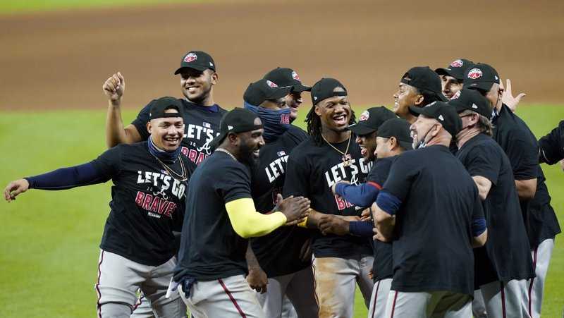 Atlanta Braves players celebrate after defeating the Miami Marlins 7-0 in Game 3 of the NLDS