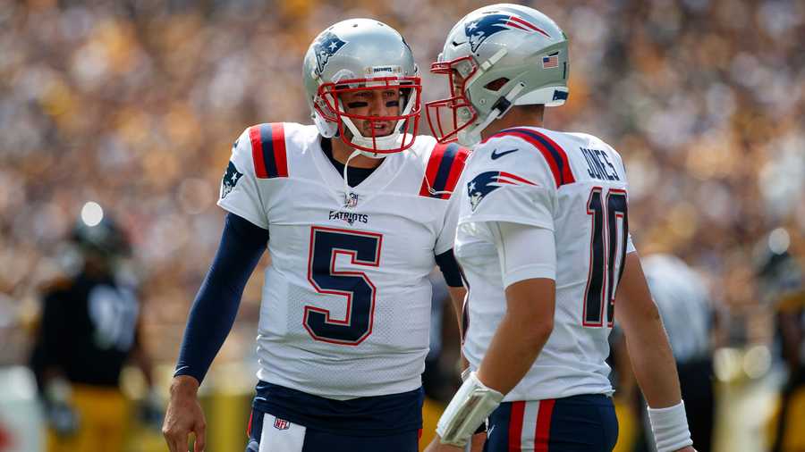 New England Patriots quarterback Brian Hoyer (5) talks with quarterback Mac Jones (10) during an NFL football game, Sunday, Sept. 18, 2022, in Pittsburgh, PA.