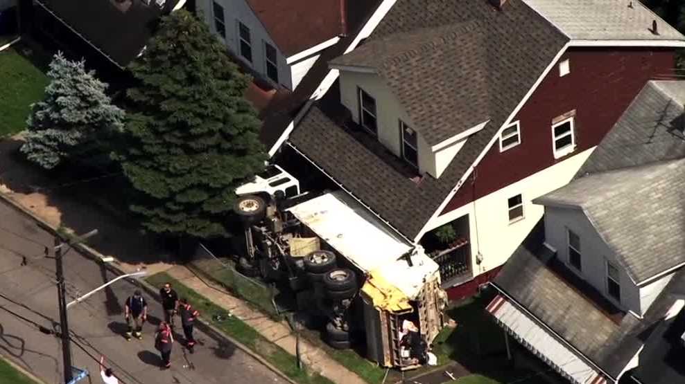 Garbage truck overturns in front of home in Pittsburgh’s Brighton Heights neighborhood