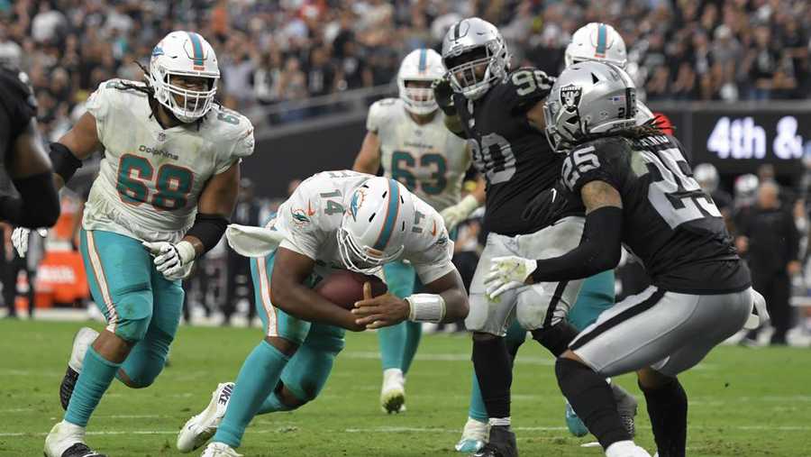 miami dolphins quarterback jacoby brissett (14) runs in for a touchdown against the las vegas raiders during the second half of an nfl football game, sunday, sept. 26, 2021, in las vegas. (ap photo/david becker)