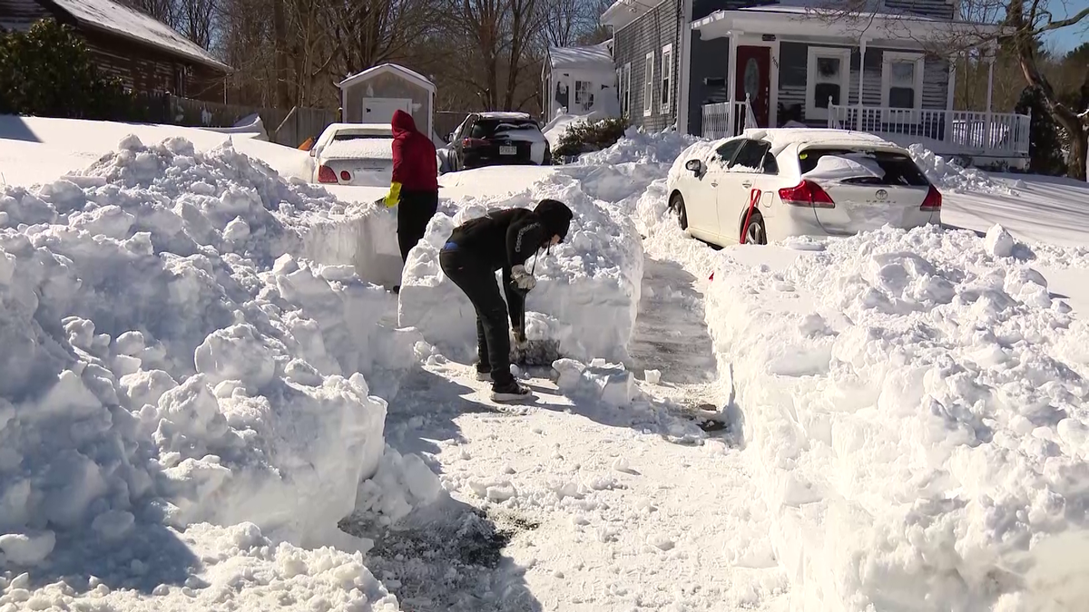 Front-end loaders, shovels and teamwork clear southeastern Massachusetts neighborhoods