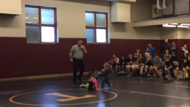Brother mistakes sister's wrestling match for real fight, runs to her rescue