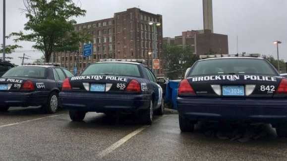 A photo shows three packed Brockton police vehicles