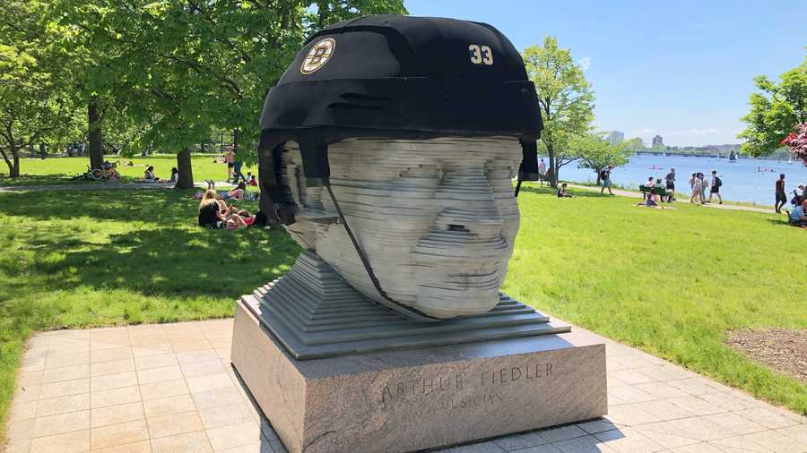 Bruins helmet on Arthur Fiedler statue along Charles River Esplanade