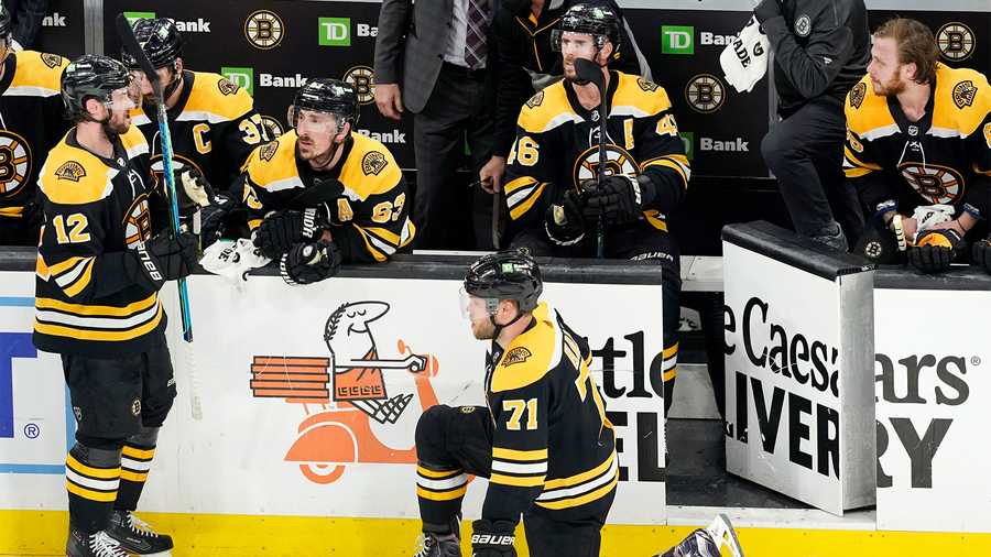 Boston Bruins players try to regroup during a timeout in the third period of Game 5 against the New York Islanders during an NHL hockey second-round playoff series, Monday, June 7, 2021, in Boston. (AP Photo)