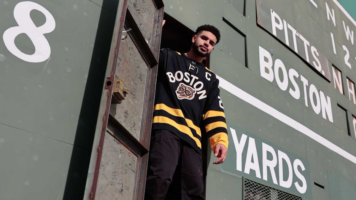 Bruins players wear vintage Red Sox uniforms before Winter Classic