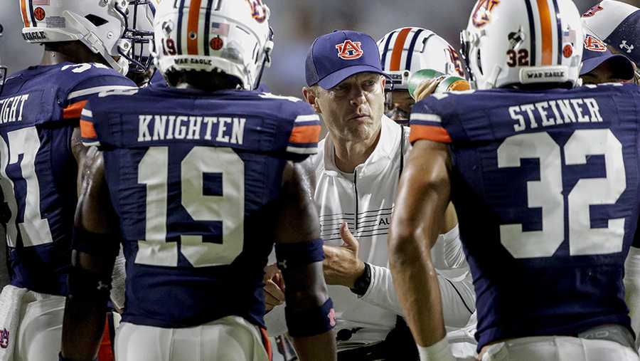 Auburn head coach Bryan Harsin talks with players in a timeout during the second half of an NCAA college football game against Akron Saturday, Sept. 4, 2021, in Auburn, Ala. (AP Photo/Butch Dill)