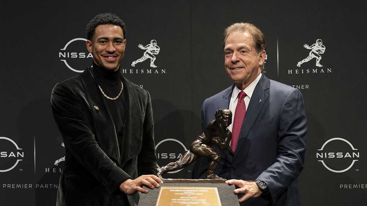 DeVonta Smith congratulates Alabama's Bryce Young for Heisman