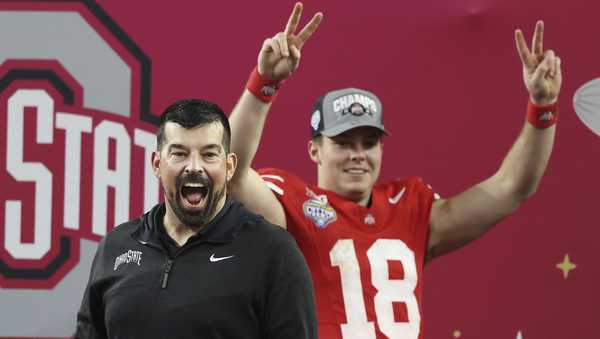 Ohio State head coach Ryan Day, left, and quarterback Will Howard (18) celebrate after the Cotton Bowl College Football Playoff semifinal game against Texas.