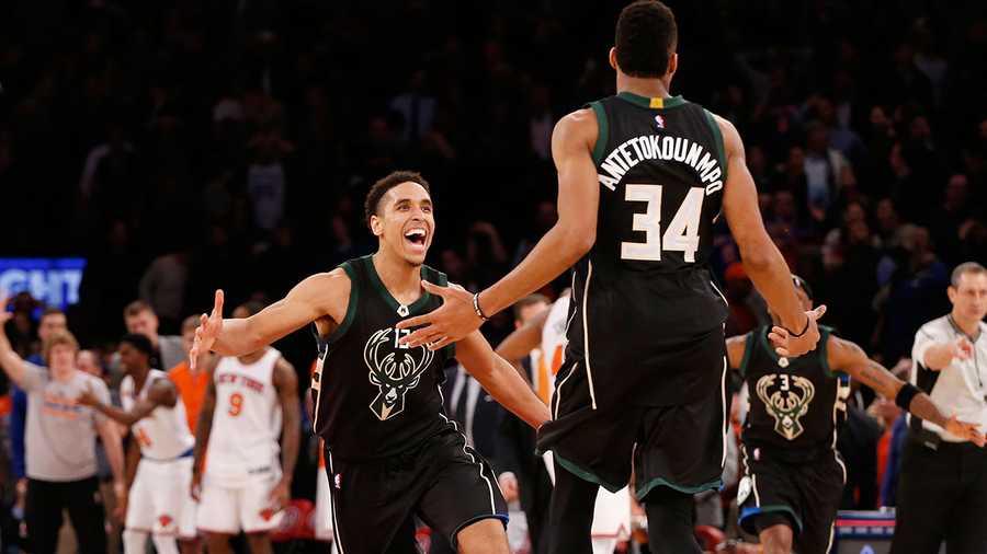 Milwaukee Bucks' guard Malcolm Brogdon (13) reacts as he runs toward Milwaukee Bucks' forward Giannis Antetokounmpo (34) who hit a buzzer-beater to defeat the New York Knicks in the waning seconds of an NBA basketball game at Madison Square Garden in New York, Wednesday, Jan. 4, 2017. The Bucks defeated the Knicks 105-104 on Antetokounmpo's shot. 