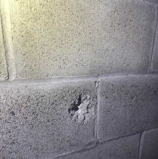 The San Joaquin County Sheriff's Office said a man's attempt at vigilante justice led to him mistakenly shooting at deputies, damaging this cement wall near where a deputy was.