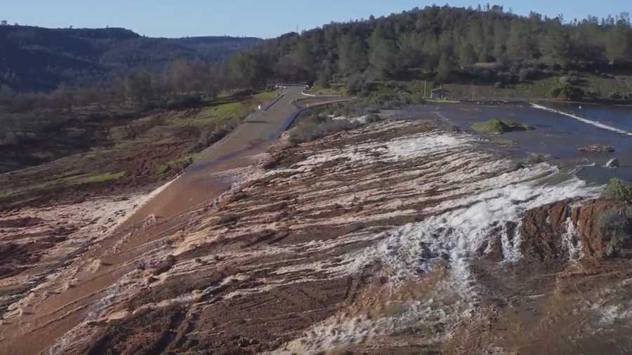 Water flows over the emergency spillway at Lake Oroville decreased Sunday, Feb. 12, 2017. By the afternoon, the flow was down to 8,000 cfs from peak of 12,600 cfs at 1 a.m. 