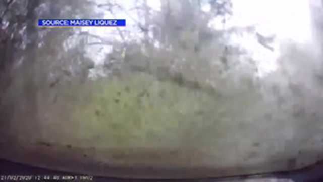 Dashboard camera captures driver tumbling down a mountain road in California.