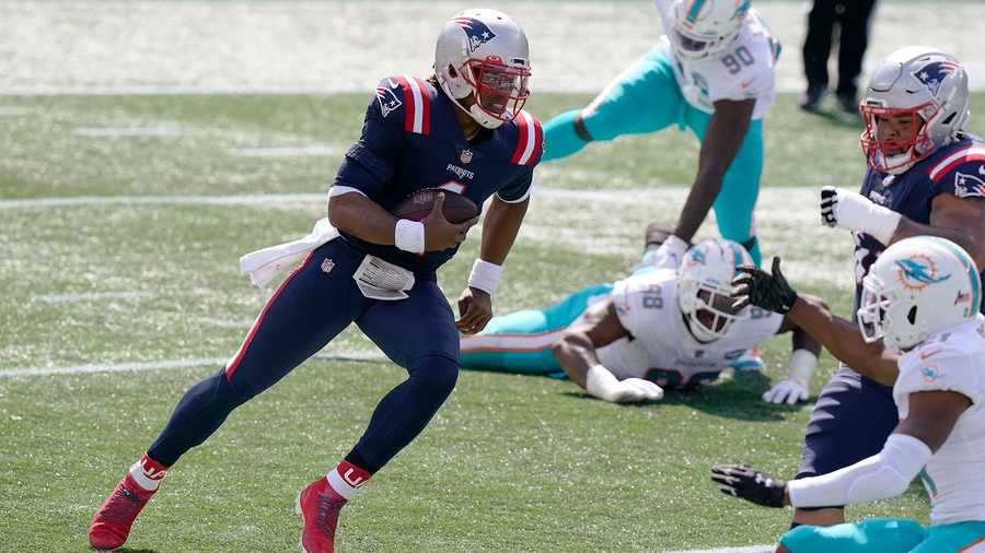 New England Patriots quarterback Cam Newton runs for a touchdown against the Miami Dolphins in the first half of an NFL football game, Sunday, Sept. 13, 2020, in Foxborough, Mass. (AP Photo/Steven Senne)