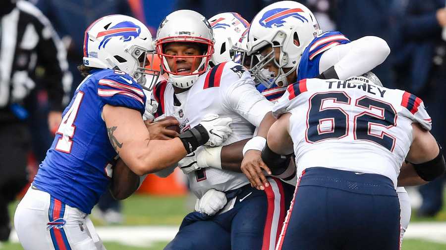 New England Patriots' Cam Newton (1) is tackled during the first half of an NFL football game against the Buffalo Bills Sunday, Nov. 1, 2020, in Orchard Park, N.Y. (AP Photo/Adrian Kraus)