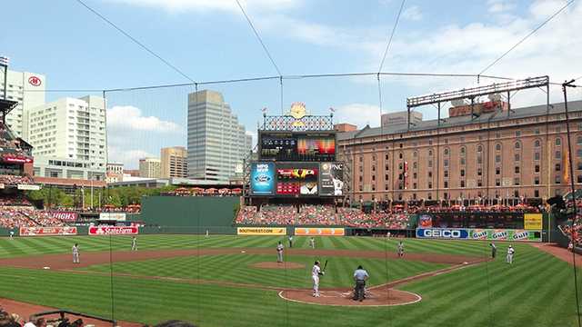 Players stand during opening game at new Camden Yards April 6