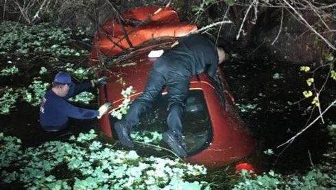 A Martin County deputy and firefighter save a woman and her dog trapped inside a sinking car.