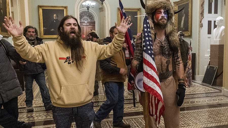 Capitol Riots Alabama man William Watson FILE - In this Wednesday, Jan. 6, 2021 file photo supporters of President Donald Trump are confronted by U.S. Capitol Police officers outside the Senate Chamber inside the Capitol in Washington. Jacob Anthony Chansley, the Arizona man with the painted face and wearing a horned, fur hat, was taken into custody Saturday, Jan. 9, 2021 and charged with counts that include violent entry and disorderly conduct on Capitol grounds. (AP Photo/Manuel Balce Ceneta, file)
