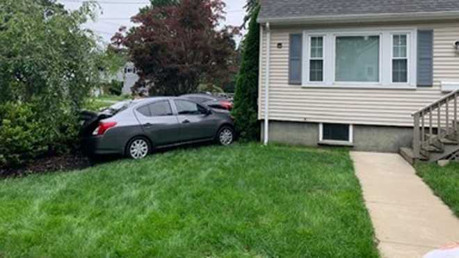 Car crashes into front yard of Arlington home; driver brandishes knife