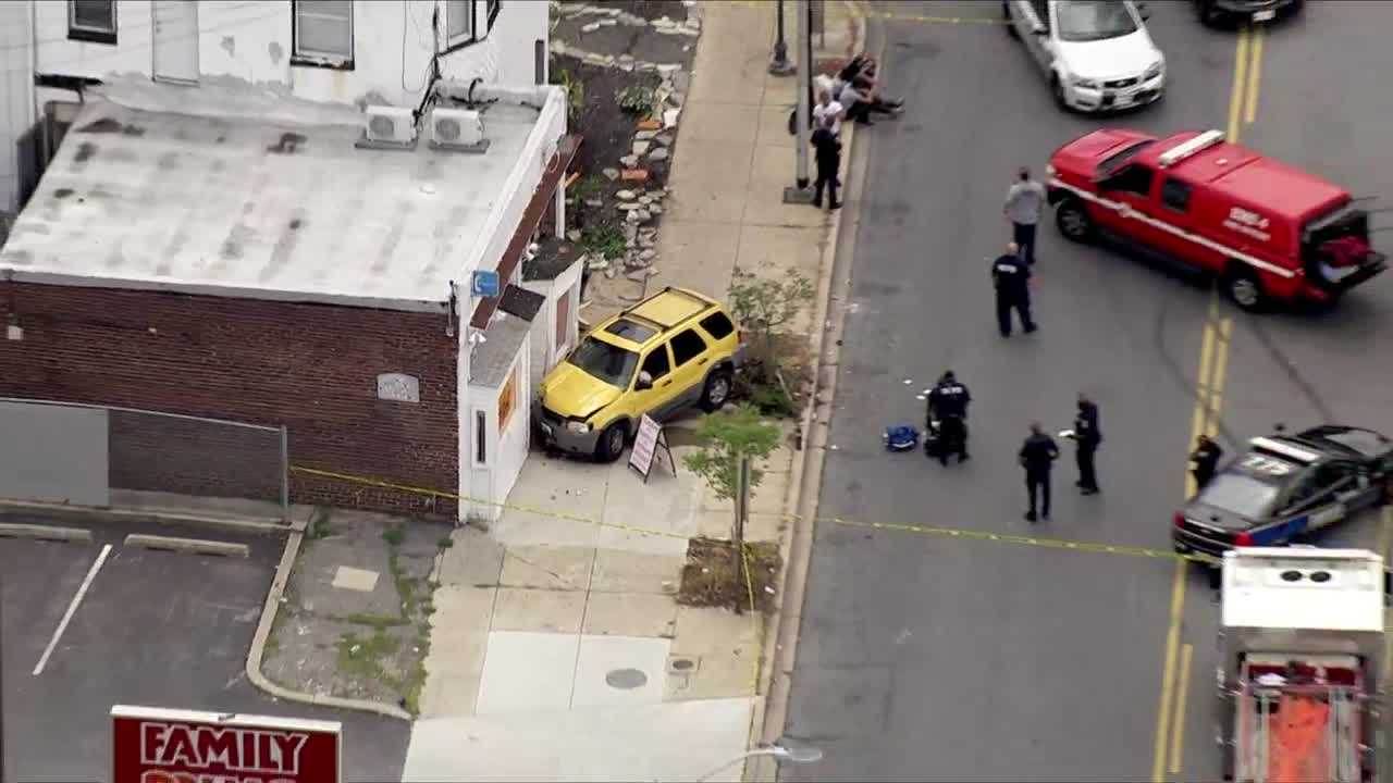 SUV Hits 2 People Before Crashing Into Building, Police Say