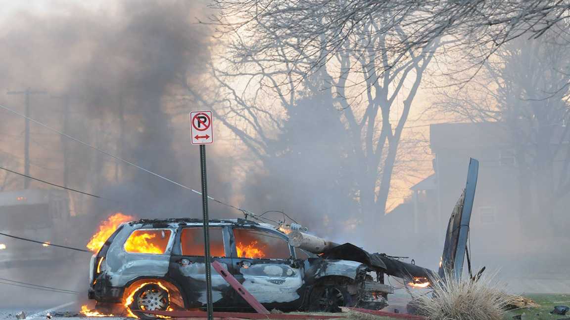 Vehicle slams into utility pole, catches fire