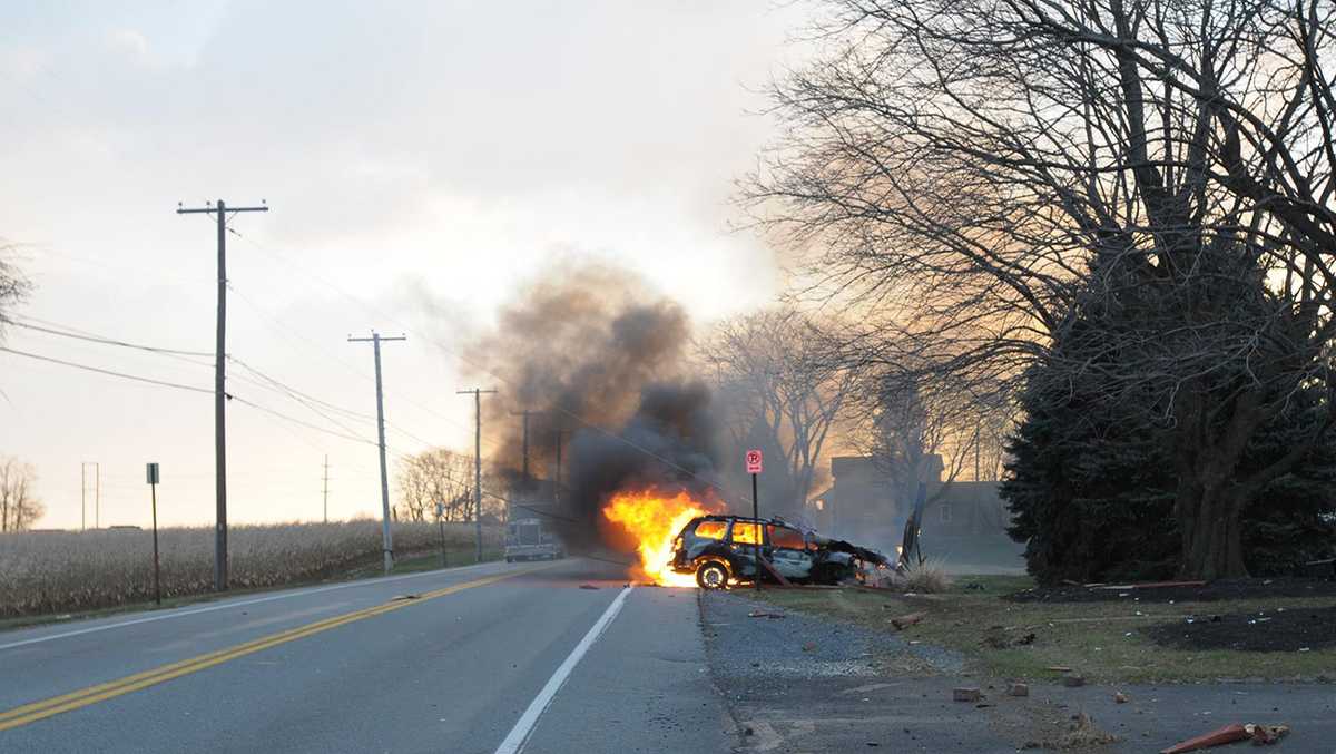 Vehicle slams into utility pole, catches fire
