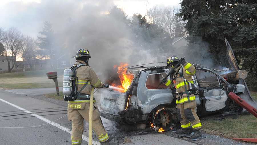 Vehicle slams into utility pole, catches fire