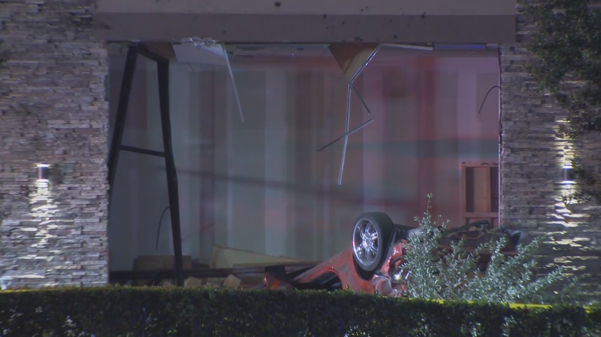 2 dead after car plows into Kissimmee building