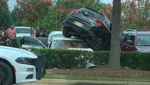 SUV Crashed On Top Of Parked Car At Renaissance suv-crashed-on-top-of-parked-car-at-renaissance