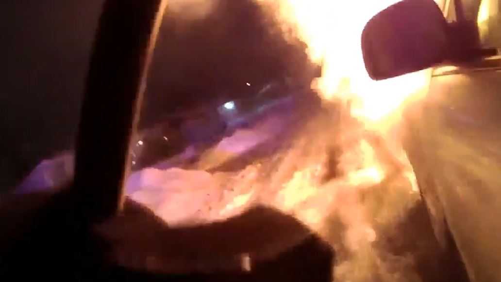 Watch Officer Rescues Woman From Burning Car