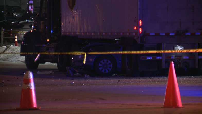 Driver crashes into truck, gets stuck underneath it