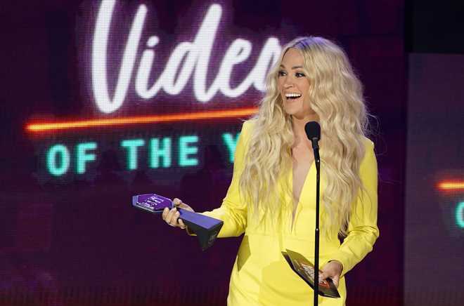 Carrie Underwood accepts the award for video of the year for &quot;Hallelujah&quot; at the CMT Music Awards at the Bridgestone Arena on Wednesday, June 9, 2021, in Nashville, Tenn.