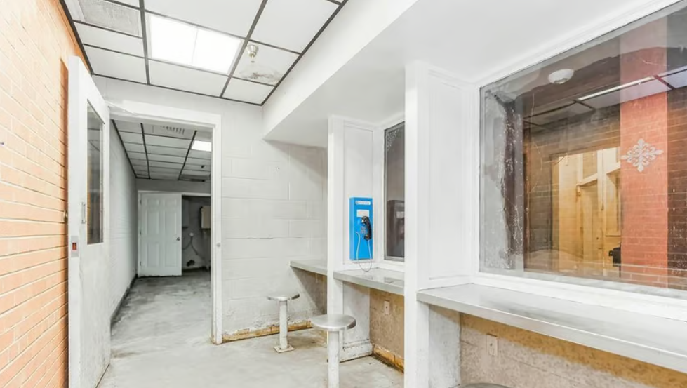 Photos show the inside of the Cass County Jail which is for sale