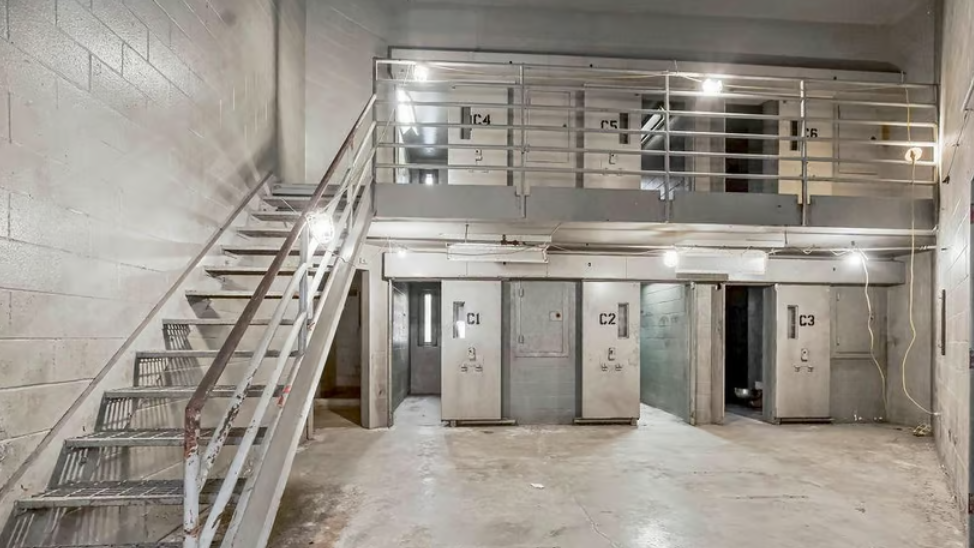 Photos show the inside of the Cass County Jail which is for sale
