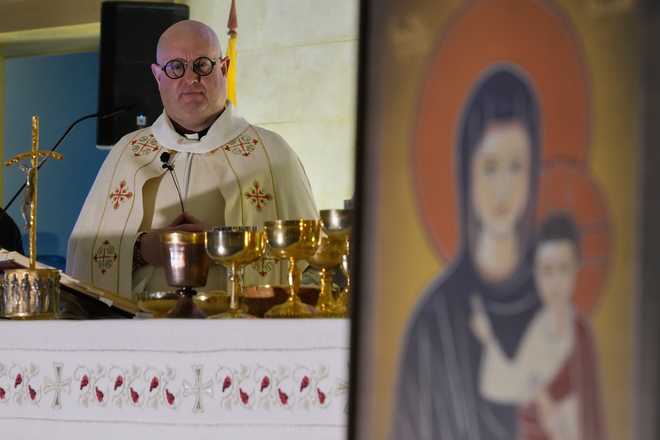 Portuguese Catholic priest and deejay Guilherme Peixoto leads a Mass ahead of his concert at the Holy Spirit University of Kaslik, Lebanon, Saturday, Jan. 10, 2026, after a Lebanese court rejected a petition to ban his concert.