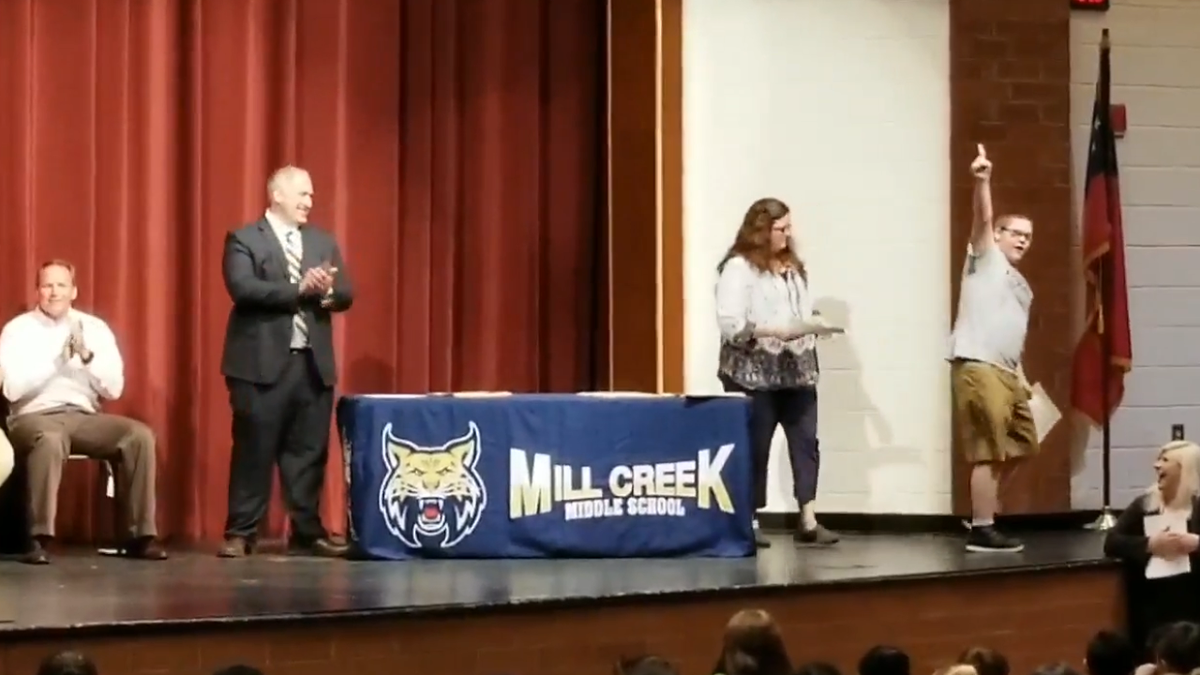 Overjoyed: Eighth grader can’t contain his excitement after winning school Kindness Award