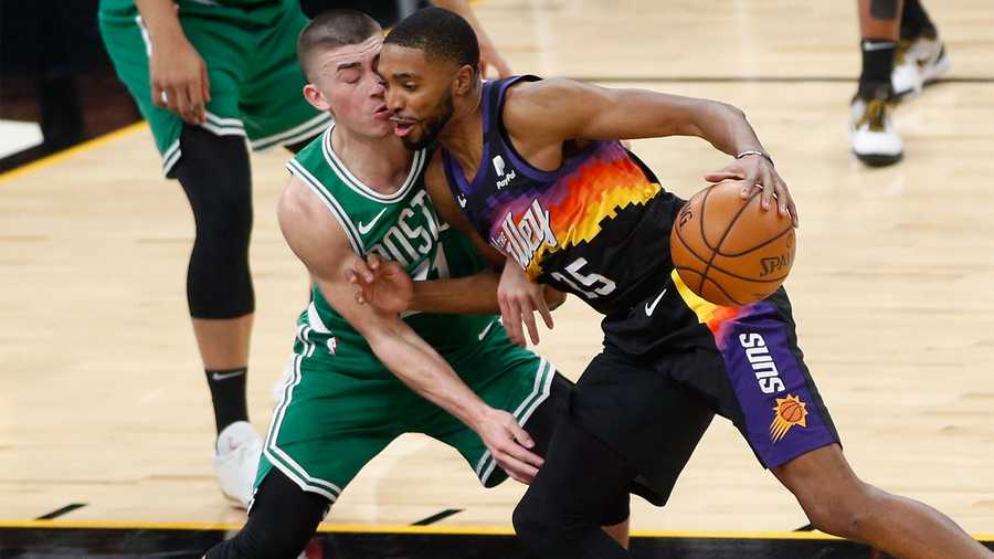 Mikal Bridges of the Phoenix Suns dribbles during the game against
