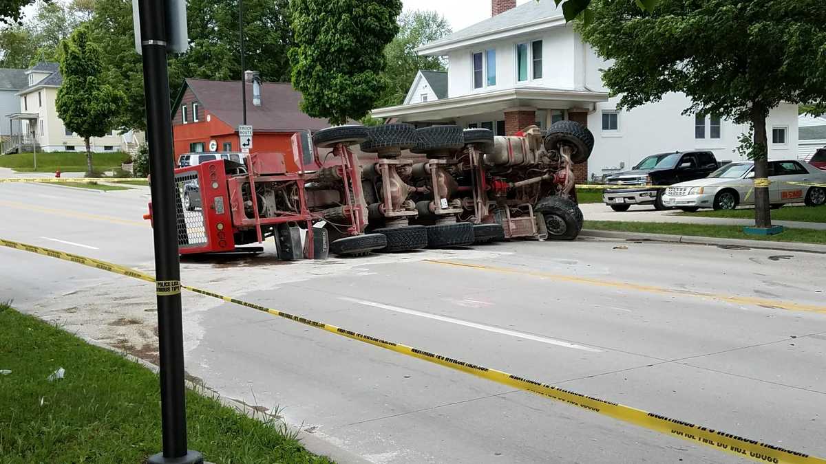 Multivehicle crash Cement truck rolls over, debris scattered all around