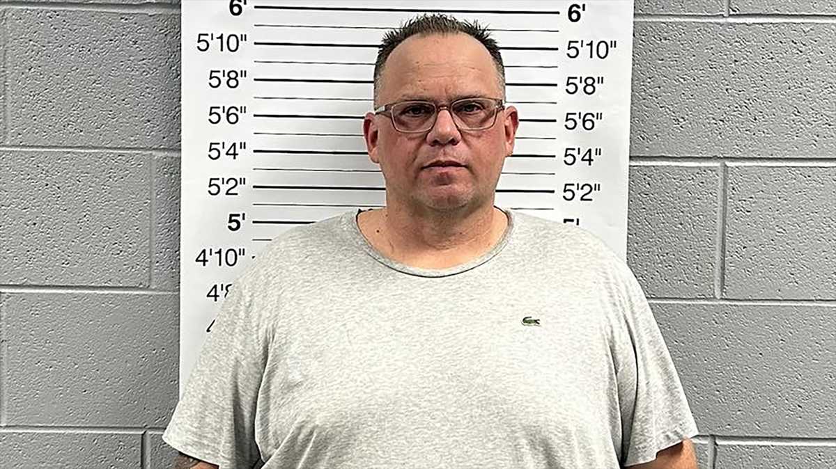 Man accused of pointing gun at man and kids in parking lot