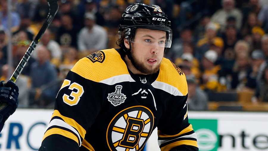 Charlie McAvoy leaves ice after crashing into goal post headfirst