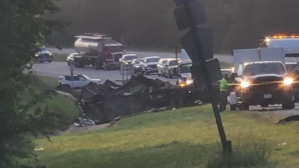 Overturned truck catches fire, blocks traffic on 412 near Beaver Lake