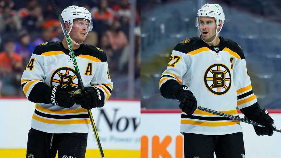 Boston Bruins' Chris Wagner, left, and John Moore play during a preseason NHL hockey game, Monday, Oct. 4, 2021, in Philadelphia. (AP Photo)